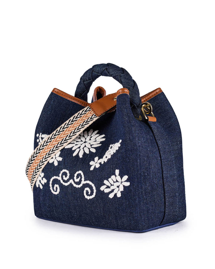 Navy blue denim handbag with floral embroidery and braided handle