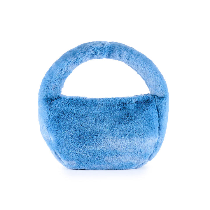 Blue faux fur handbag with handle against white background