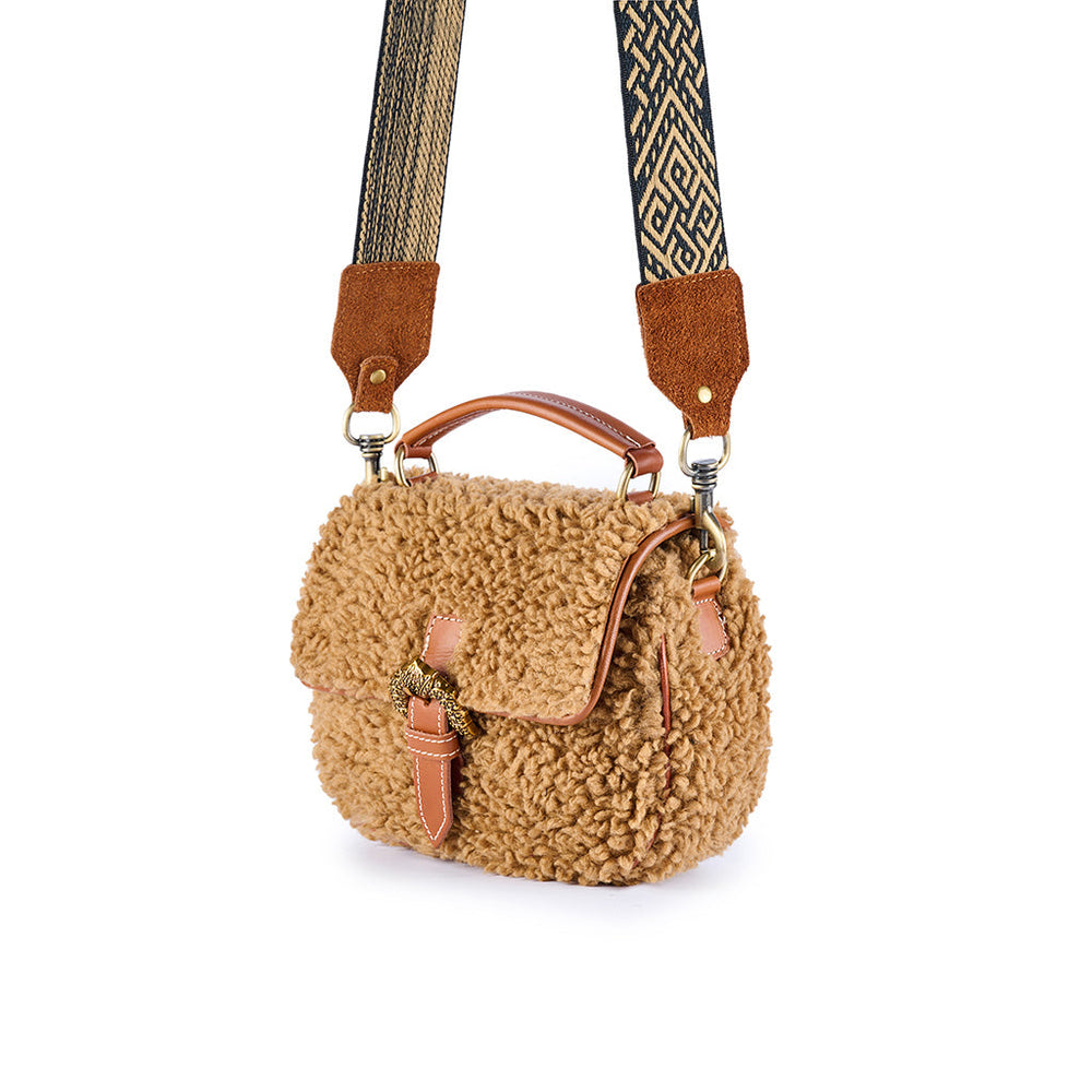 Brown faux fur handbag with patterned adjustable strap and leather accents