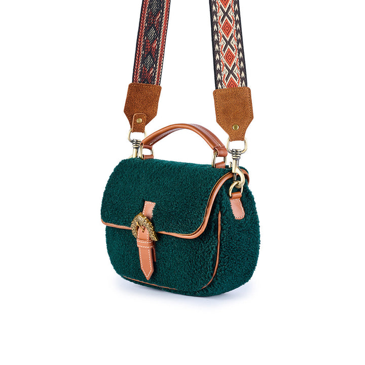 Green woolen crossbody bag with patterned strap and leather accents