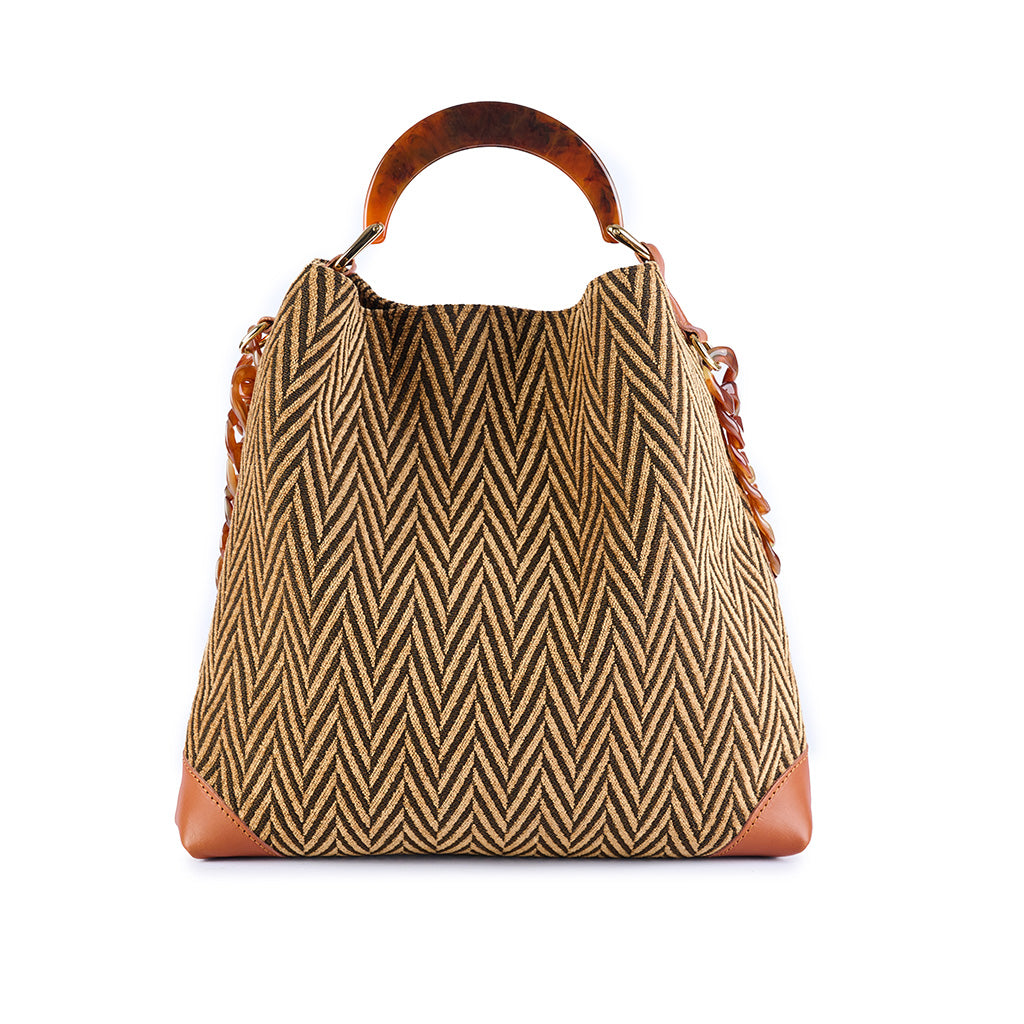 Stylish herringbone pattern handbag with brown leather accents and wooden handle