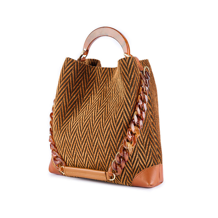 Geometric patterned tote bag with leather accents and chain strap