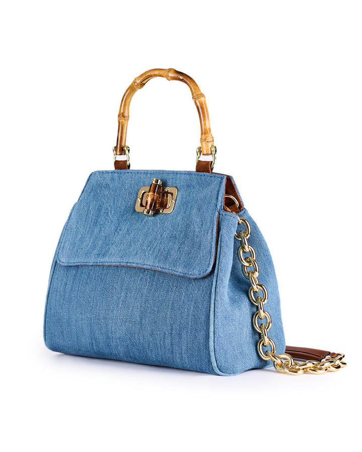 Blue denim handbag with bamboo handles and gold chain strap