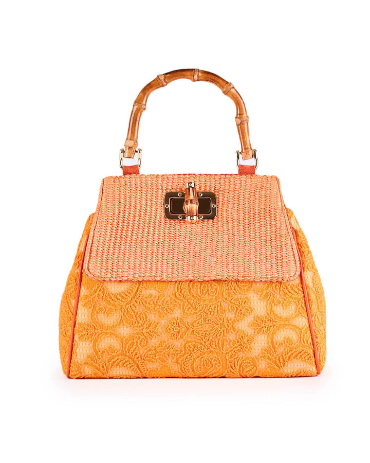 Elegant orange woven handbag with bamboo handle and intricate floral design