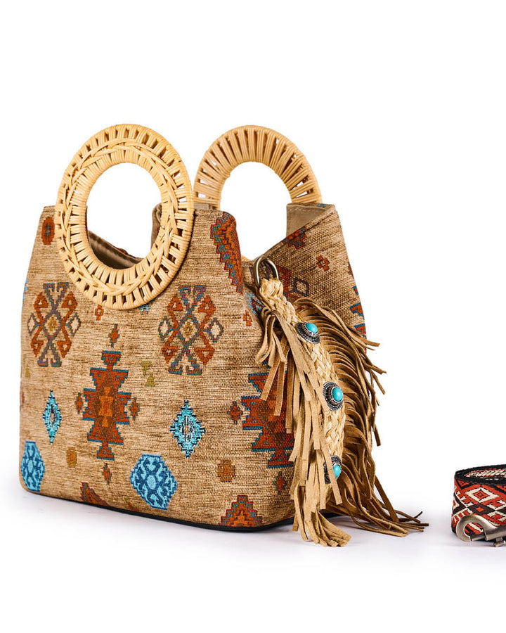 Handwoven boho-chic handbag with Aztec patterns and wooden handles decorated with tassels and blue stones