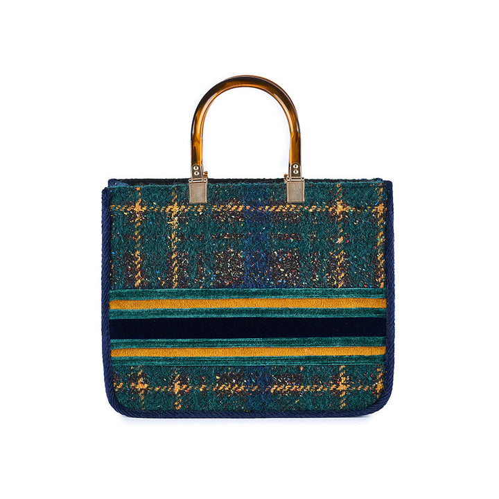 Green plaid handbag with gold handles and striped detail