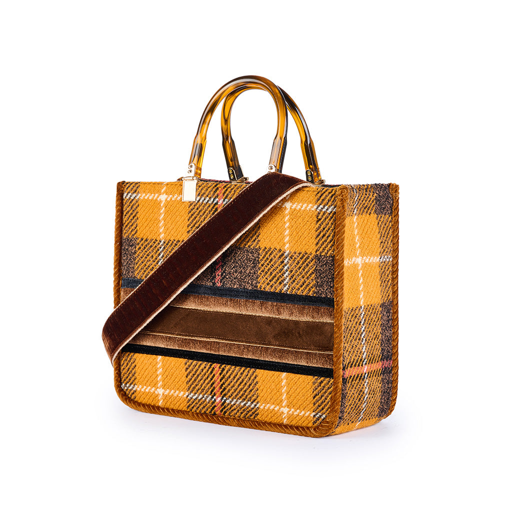 Yellow plaid handbag with brown handles and a brown strap