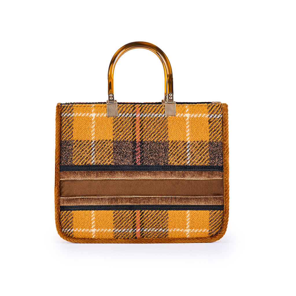 Yellow plaid handbag with brown and beige velvet stripes and amber-colored handles