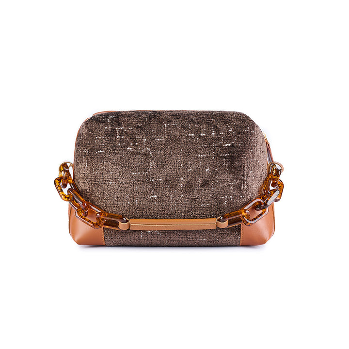 Elegant brown handbag with textured fabric and amber chain strap