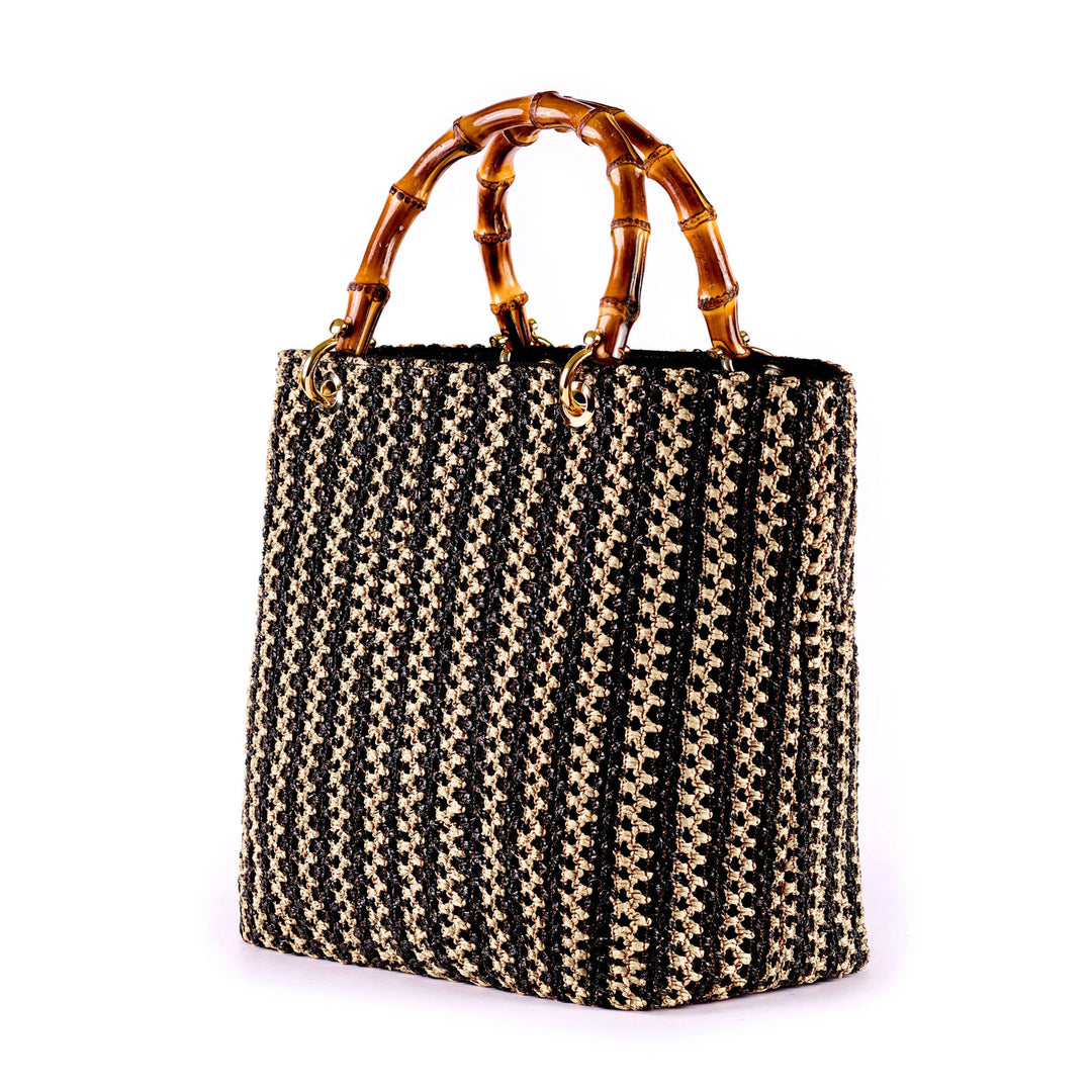 Black and beige woven handbag with bamboo handles