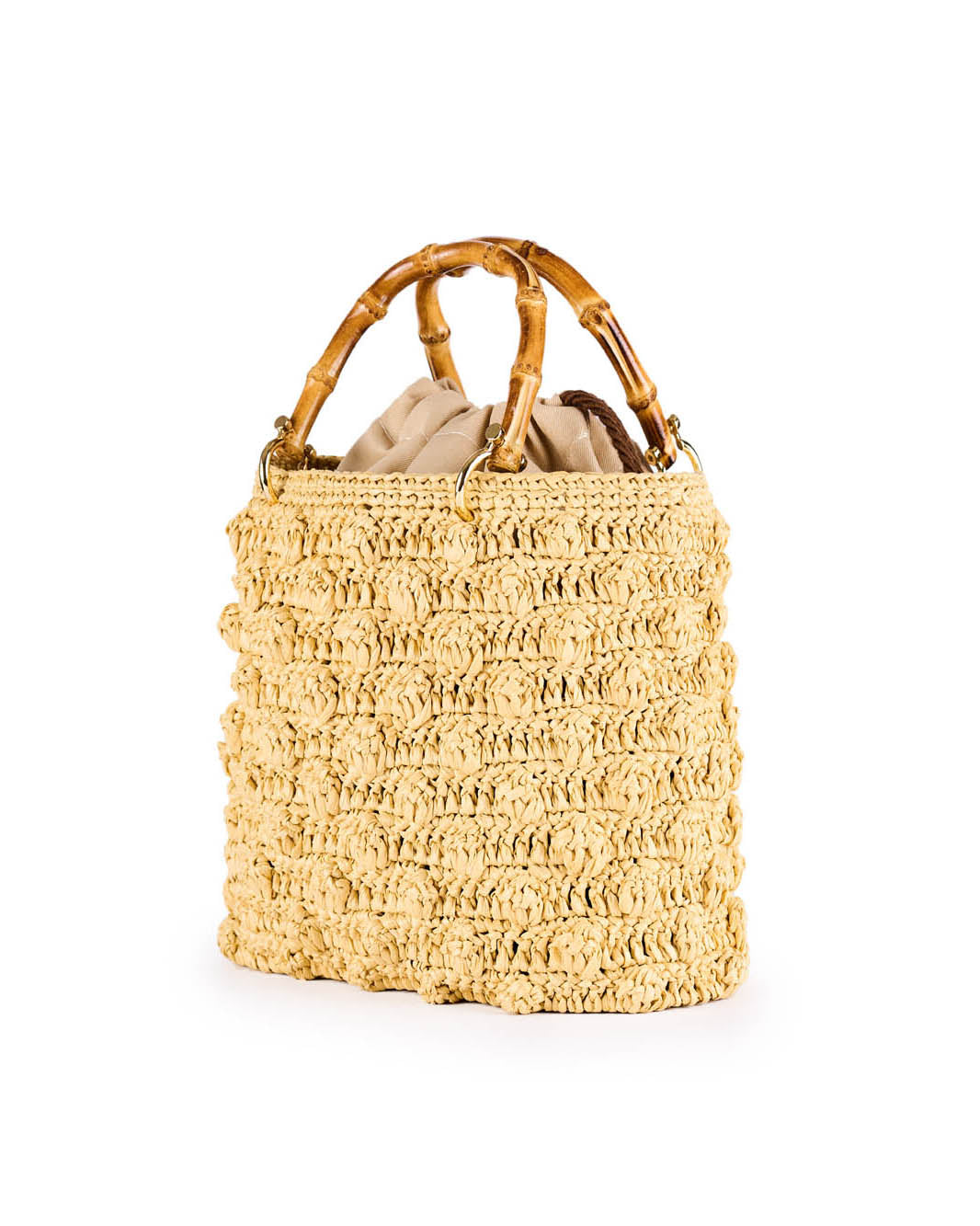 Handwoven straw tote bag with bamboo handles and beige interior lining