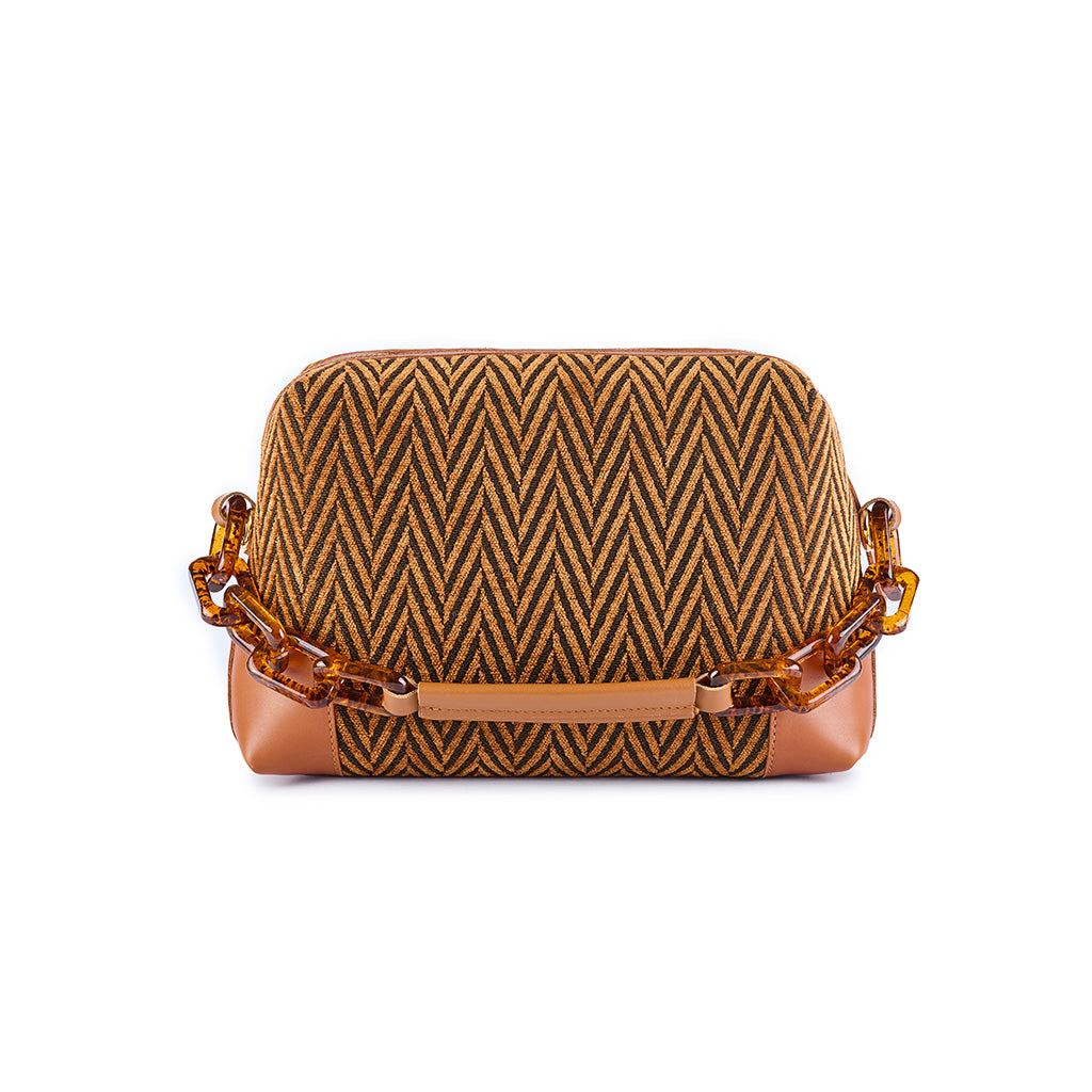 Patterned handbag with brown and black chevron design, gold strap, and brown leather accents