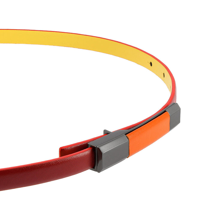 Colorful modern belt with a red exterior, yellow interior, and geometric buckle