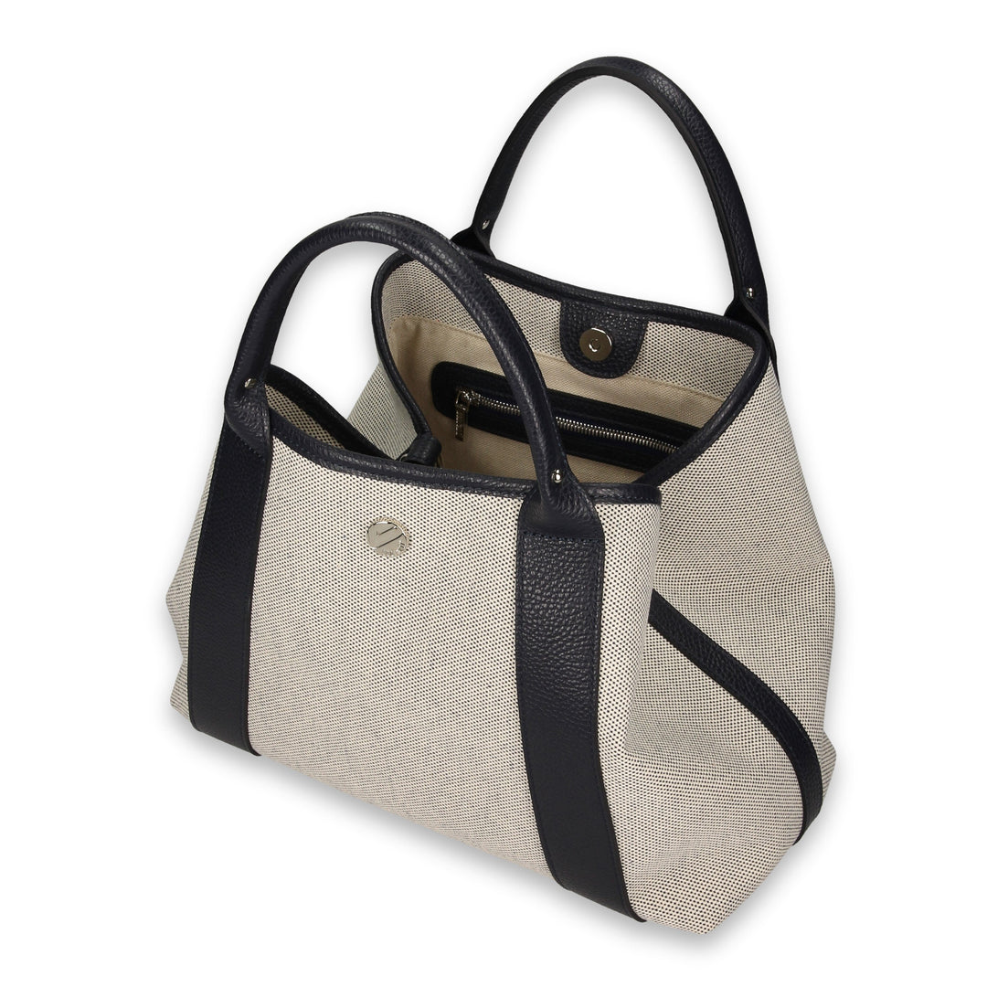 Beige and black leather tote bag with open compartments