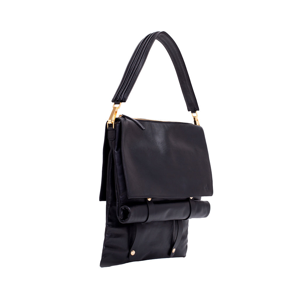 Stylish black leather handbag with fold-over design and gold accents