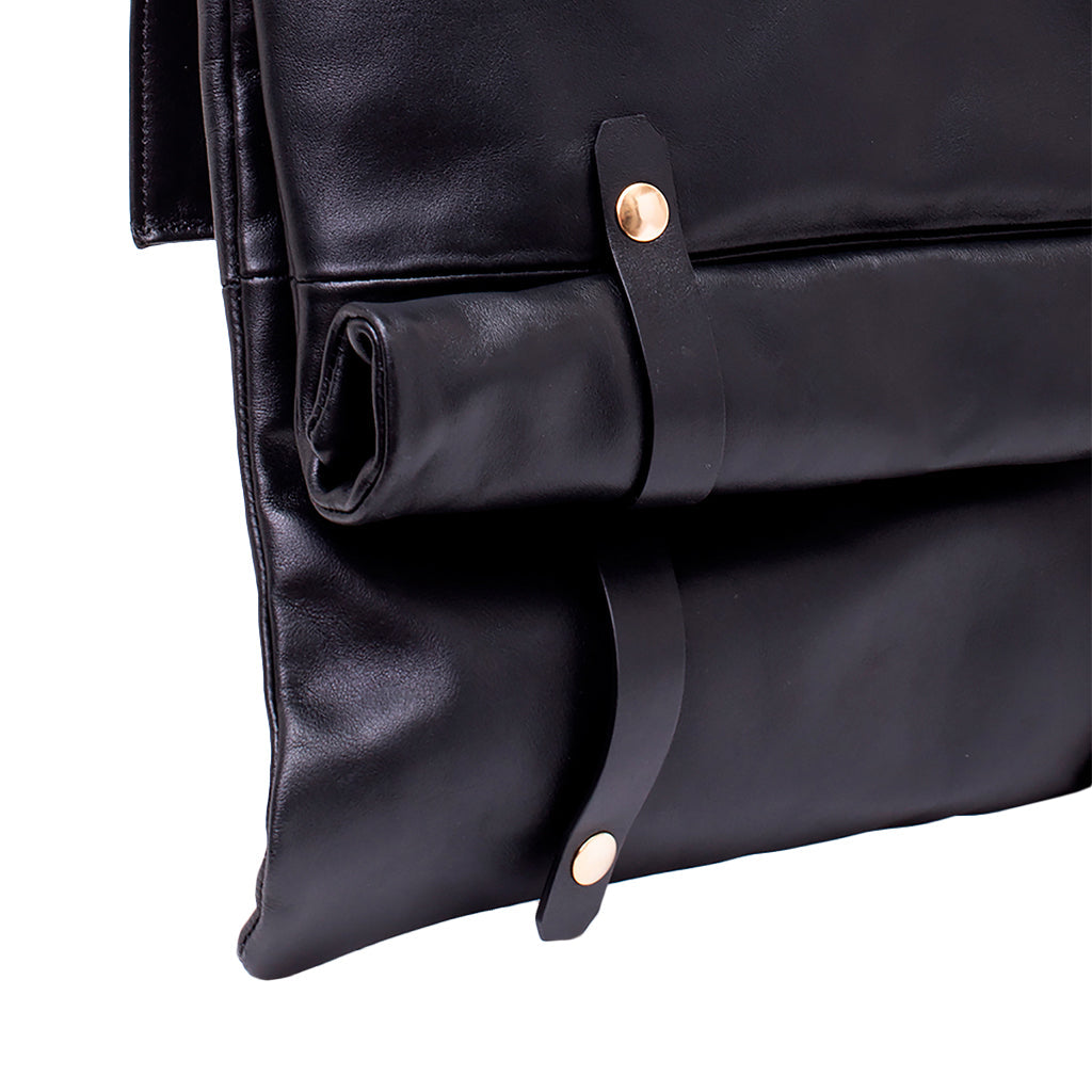 Black leather laptop sleeve with strap and button closures