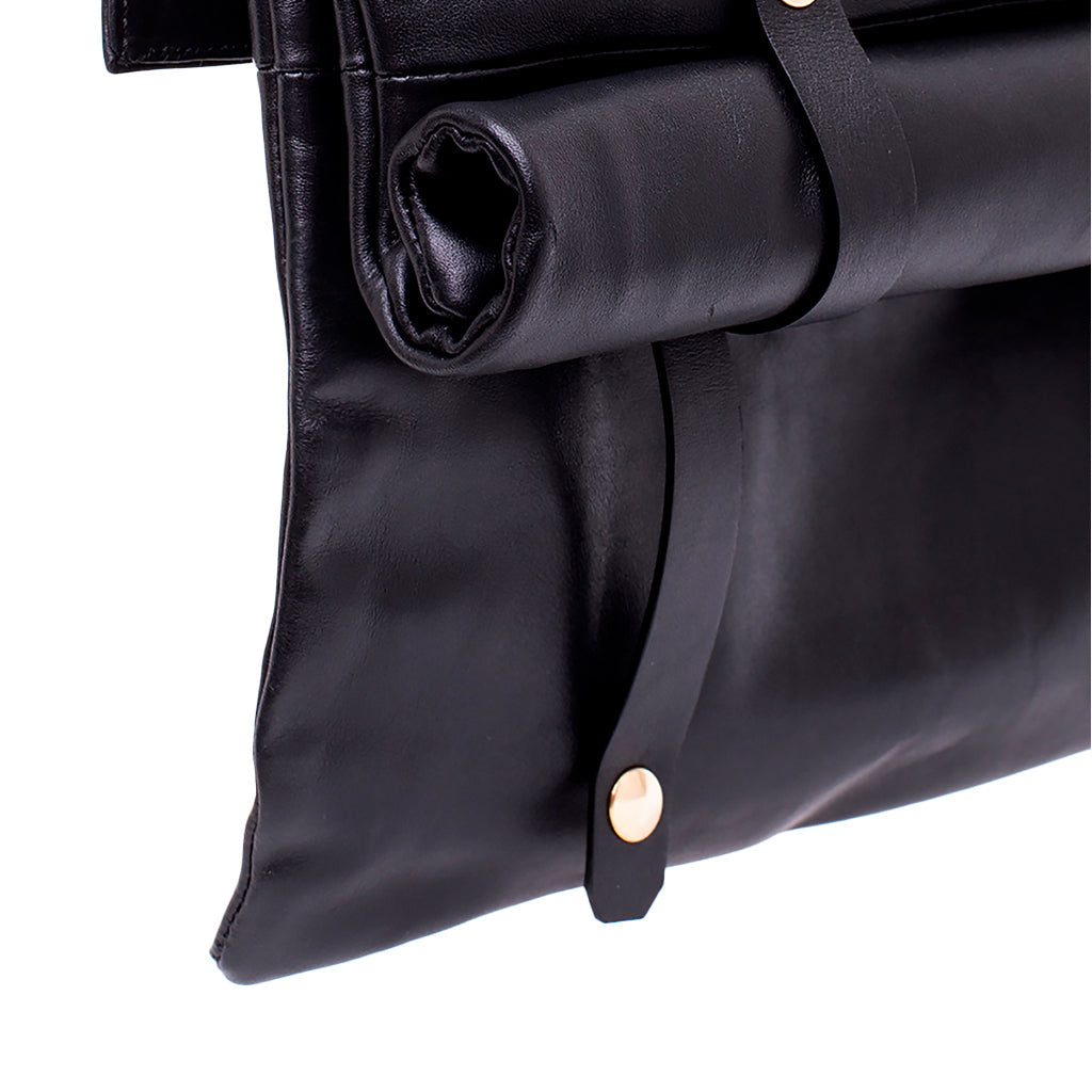 Black leather clutch with gold button accents