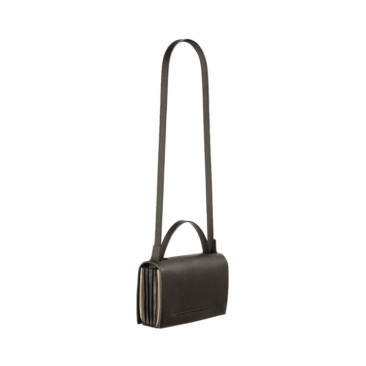 Sleek black leather handbag with long shoulder strap and minimalist design