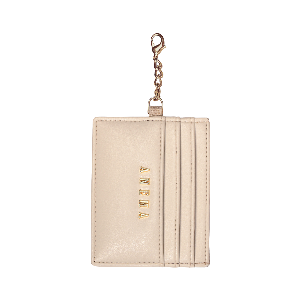 Beige leather card holder with keychain and four card slots