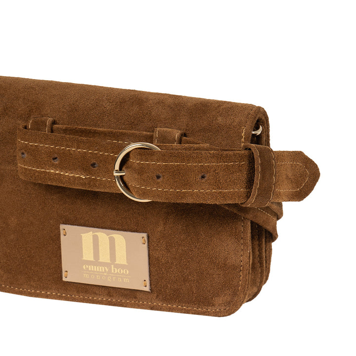 Brown suede clutch bag with belt buckle strap and logo tag