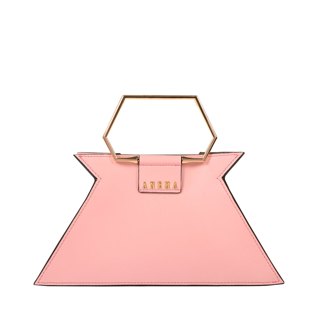 Pink designer handbag with geometric gold handle