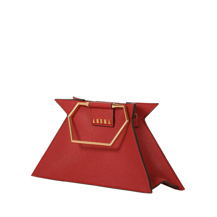 Red luxury handbag with geometric design and gold handle