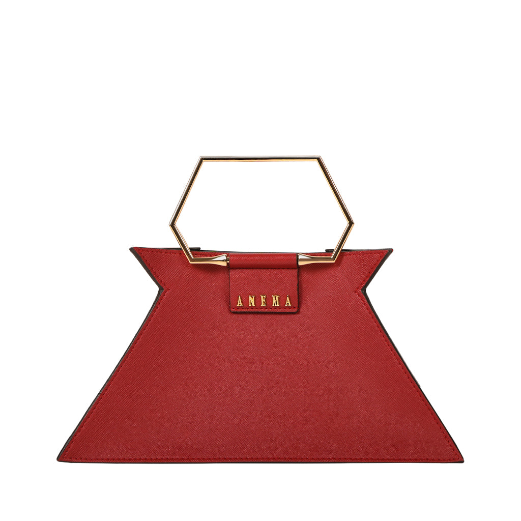 Red designer handbag with geometric handle and ANEMA brand logo