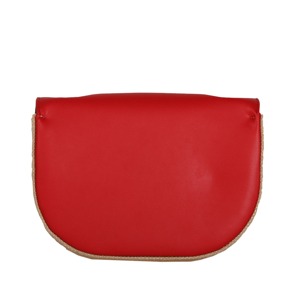 Red leather handbag with beige trim on white background