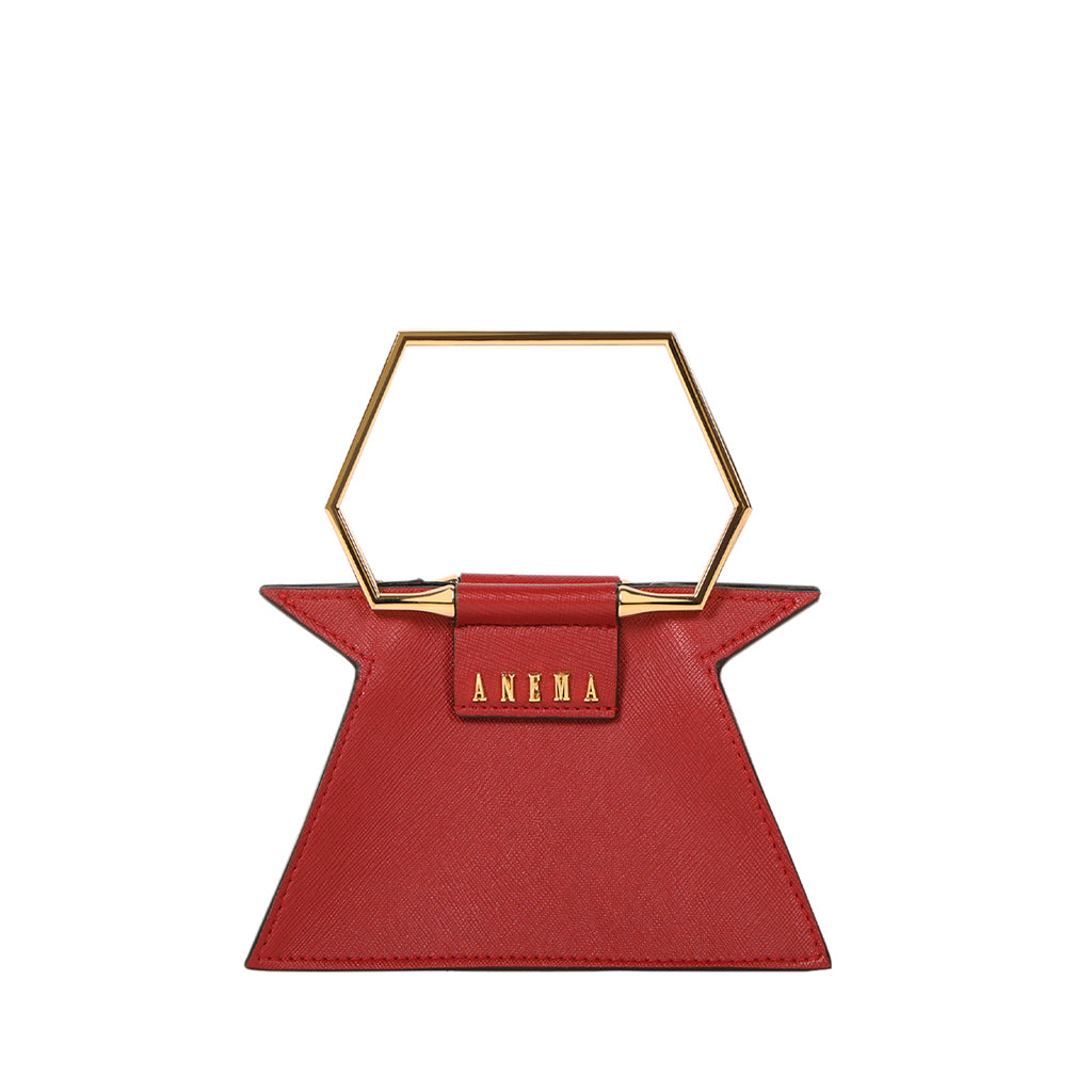 Red geometric handbag with gold hexagonal handle and ANEMA branding