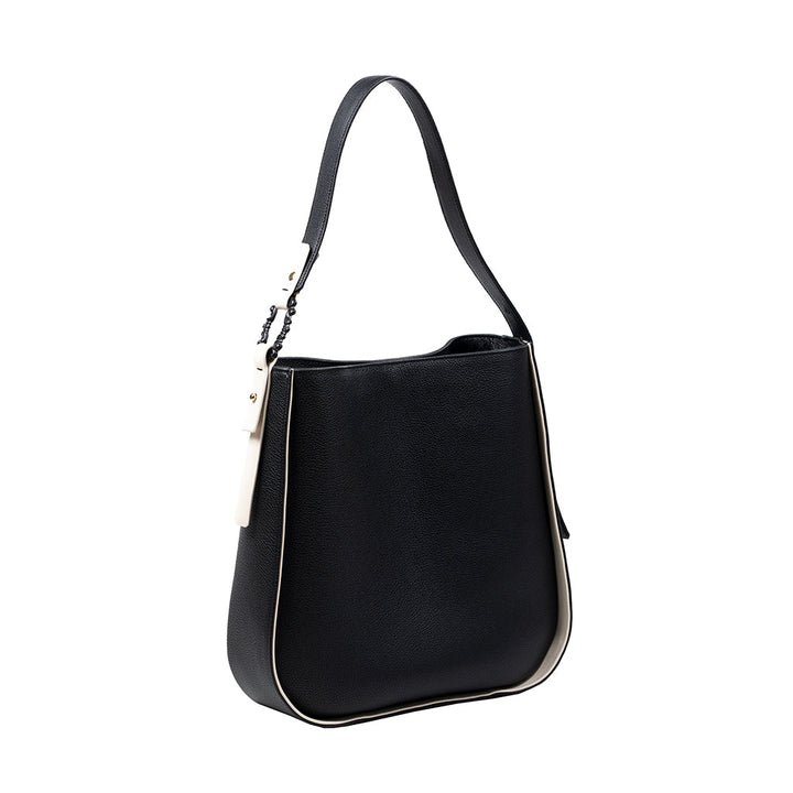 Black leather handbag with white trim and a single shoulder strap