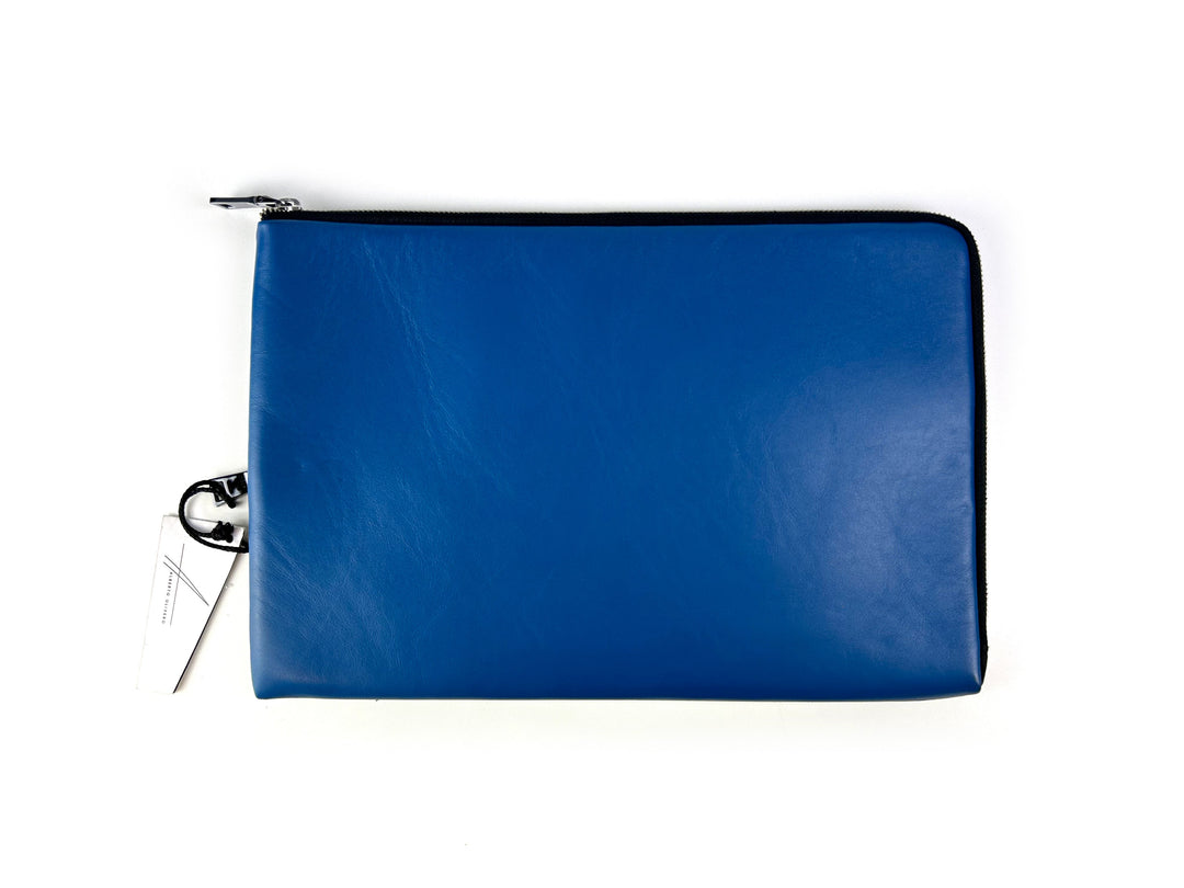 Blue leather zippered pouch on white background