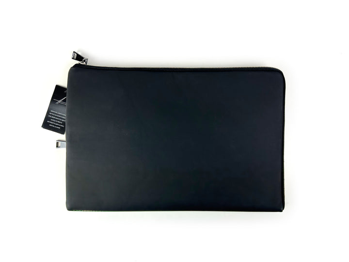 Black leather laptop sleeve with zipper on a white background