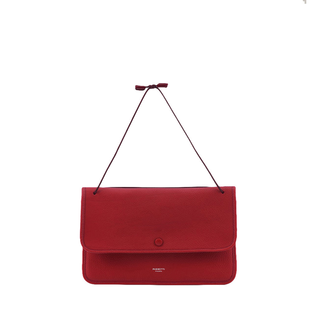 Red leather handbag with a slim shoulder strap and minimalist design