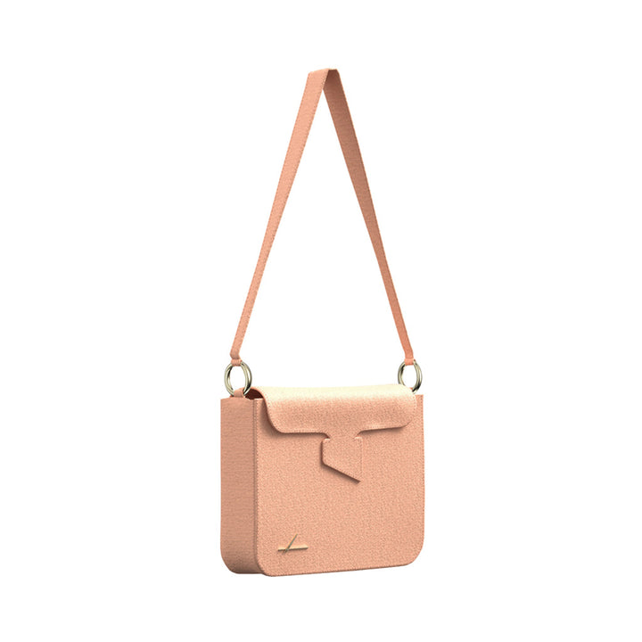 Elegant peach shoulder bag with adjustable strap and minimalist design