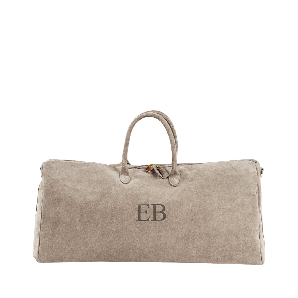 Beige suede duffle bag with initials EB and double handles