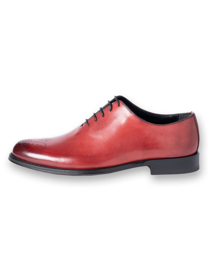 Red leather oxford dress shoe with black sole