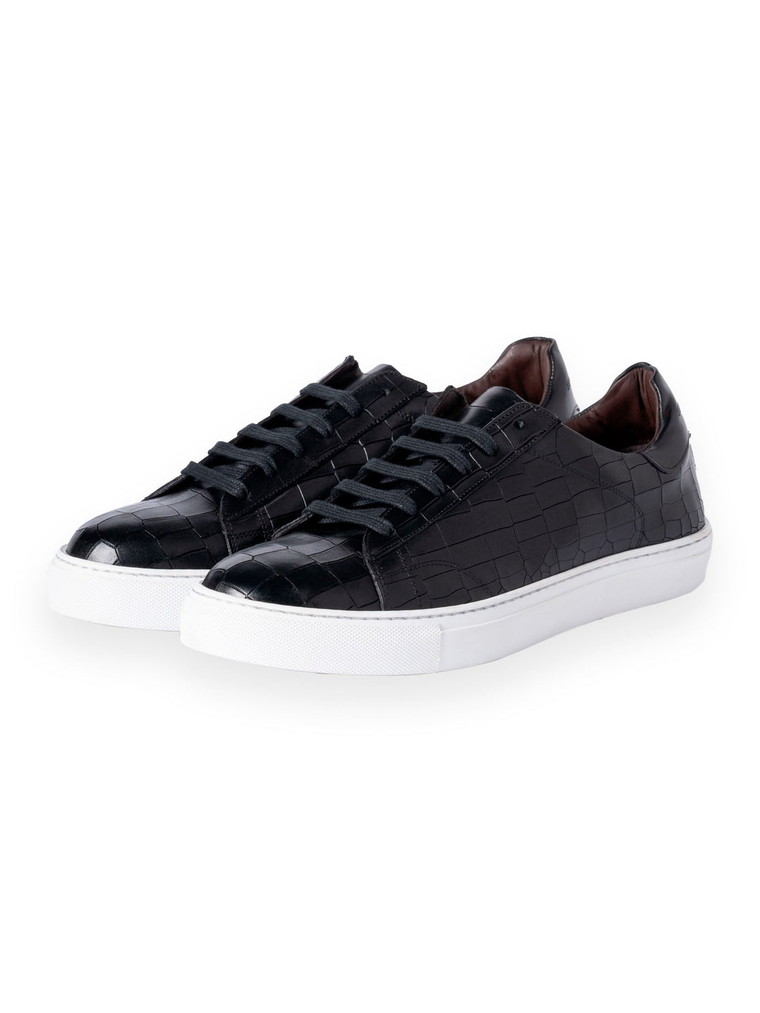 Stylish black leather sneakers with white soles