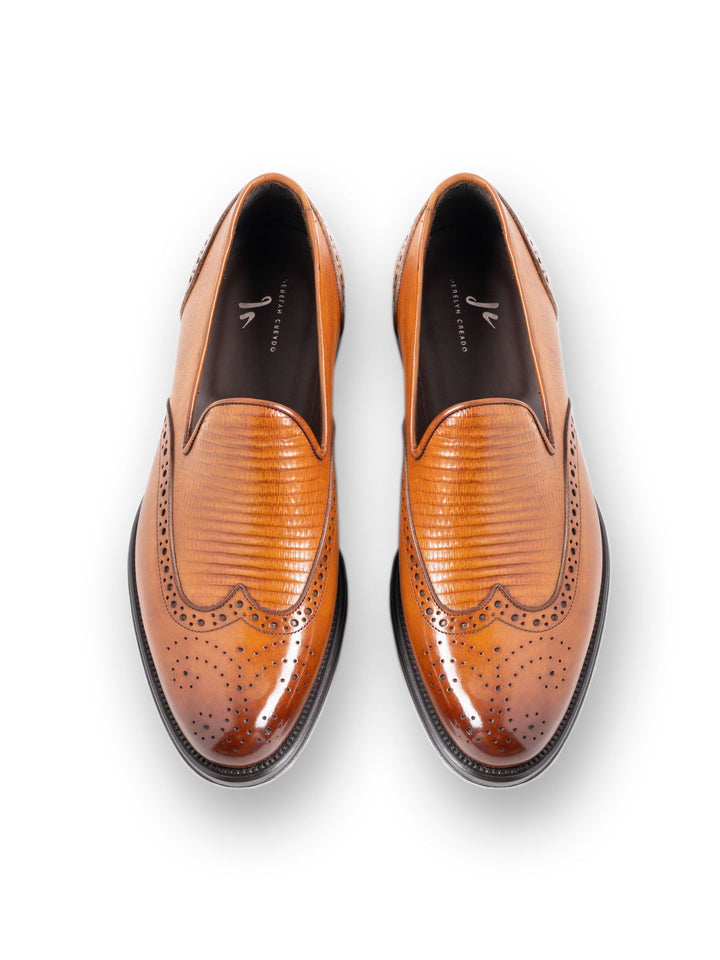 Top view of elegant brown leather brogue dress shoes for men