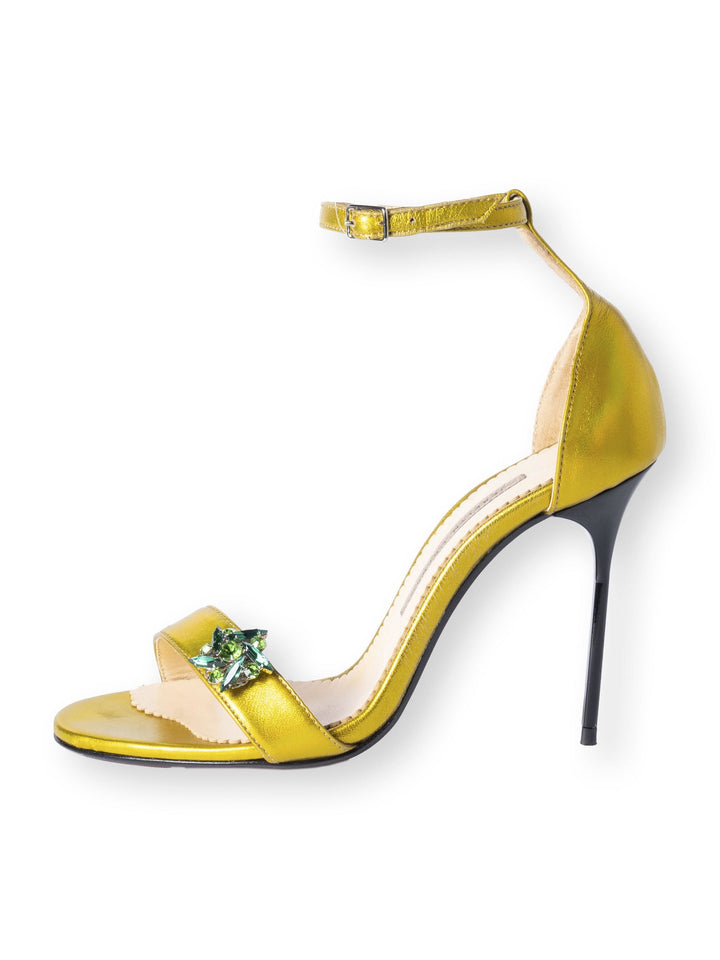 Gold high-heeled sandal with ankle strap and jeweled front