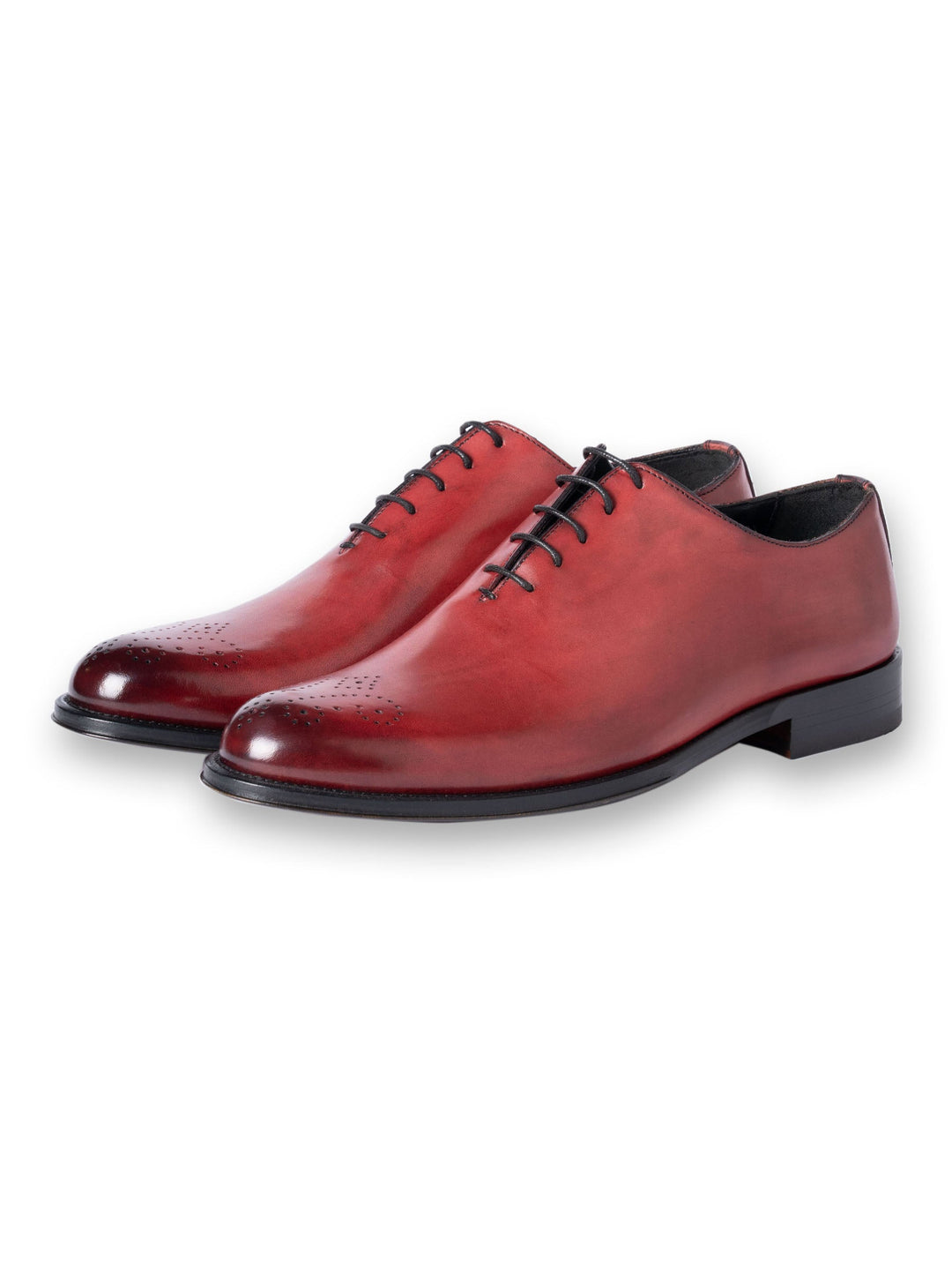 Red leather oxford dress shoes with black laces and detailed toe cap design