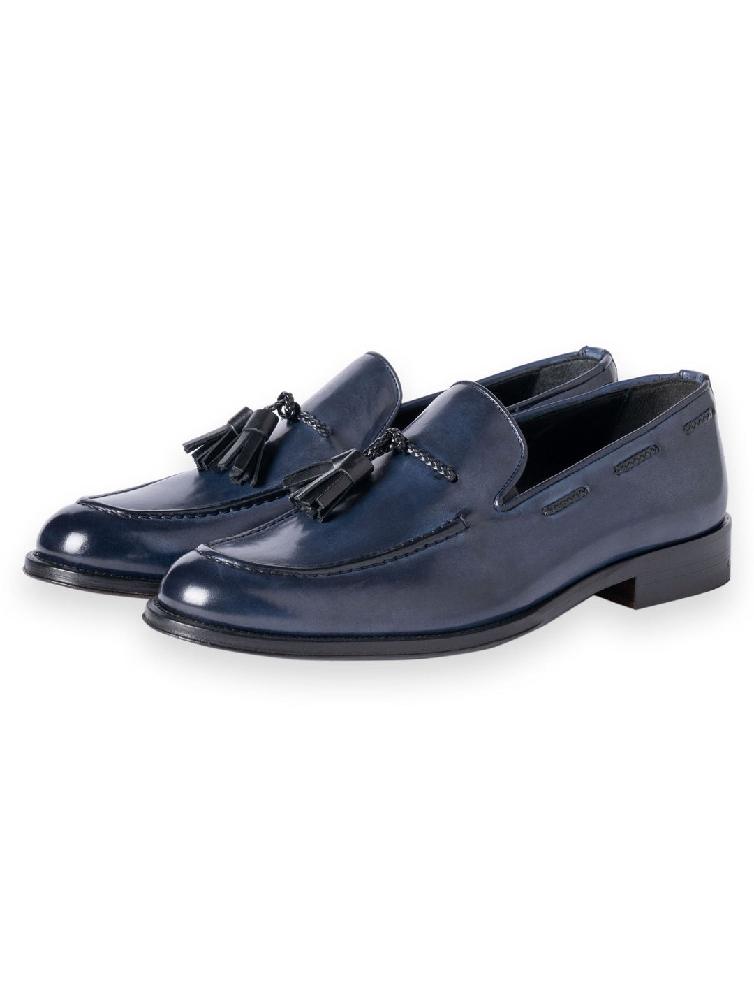 navy blue leather tassel loafers on white background