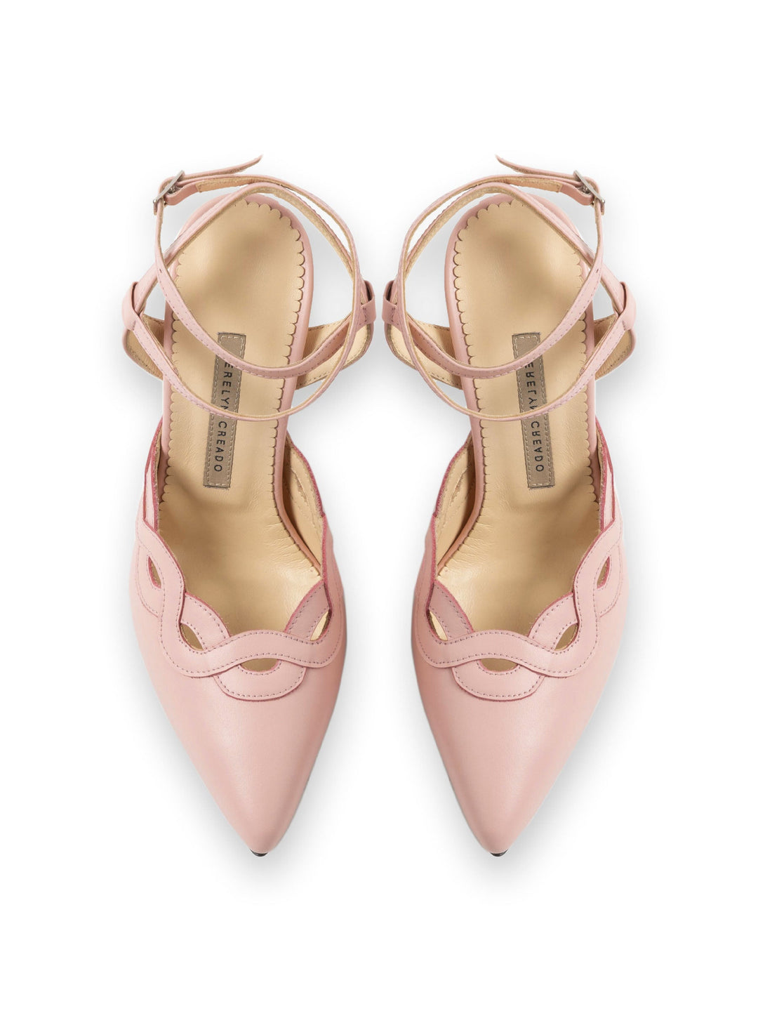 Pink strappy pointed-toe heels with scalloped edges