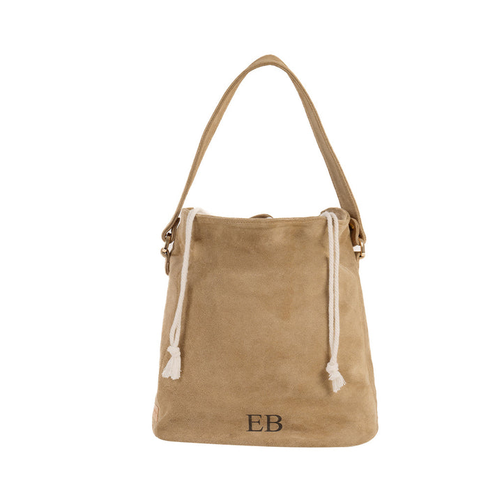 Beige suede tote bag with white drawstring and initial EB embroidery