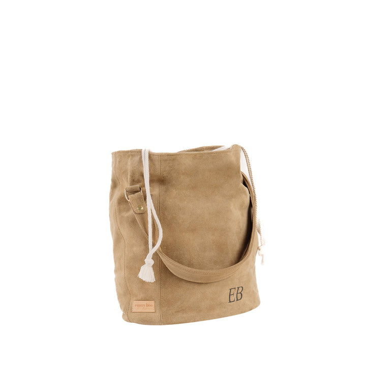 Beige suede drawstring bucket bag with shoulder strap and initials EB