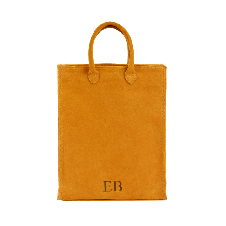 Stylish mustard yellow suede tote bag with EB initials on the front