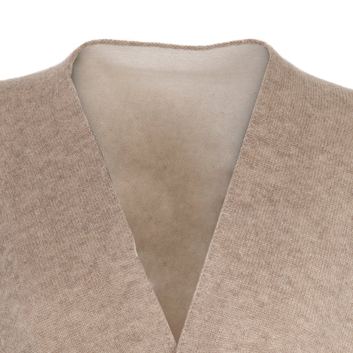 Close-up of a beige cashmere cardigan neckline