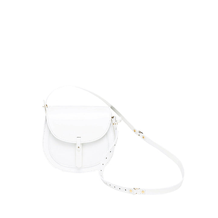 White leather crossbody bag with adjustable strap and gold-tone hardware