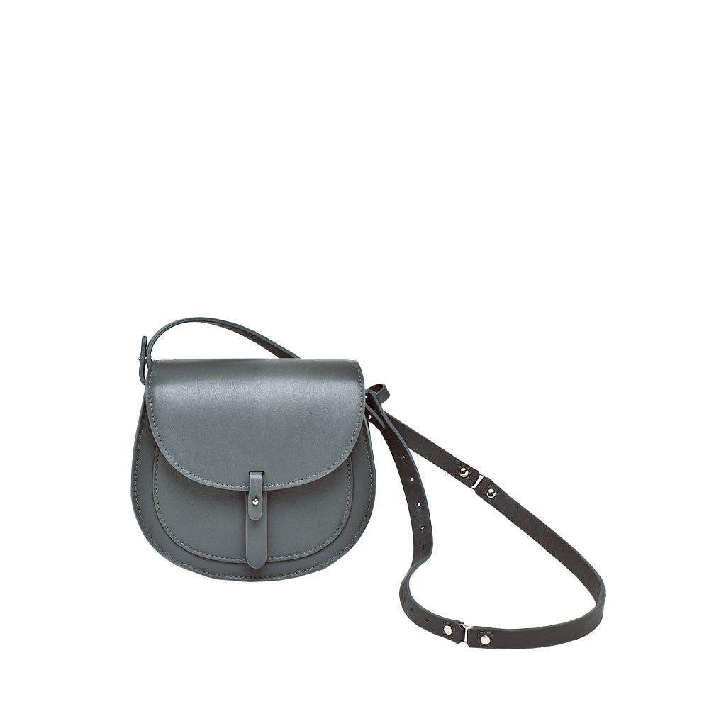 Minimalist black leather crossbody bag with adjustable strap