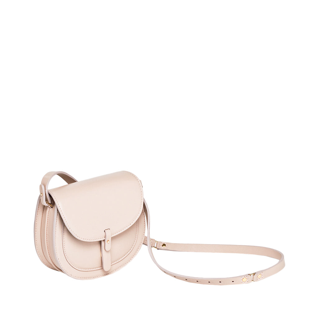 Beige leather crossbody bag with adjustable strap and buckle closure