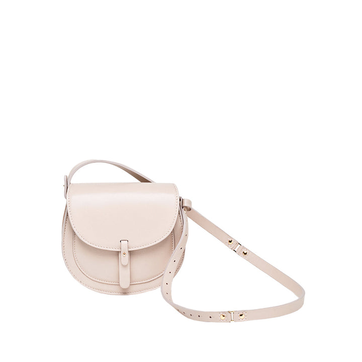 beige leather crossbody bag with flap closure and adjustable strap
